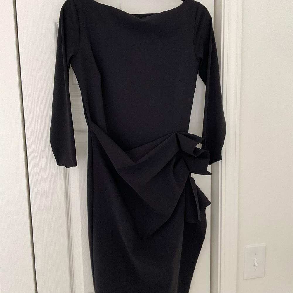 A fabulous black dress. Fitted and super flattering .